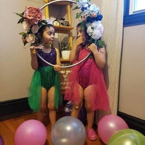 Two mermaid rompers .